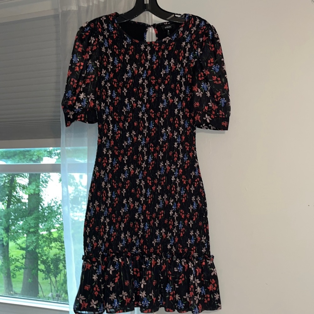 Black floral smocked bodycon dress. Super cute and flattering.